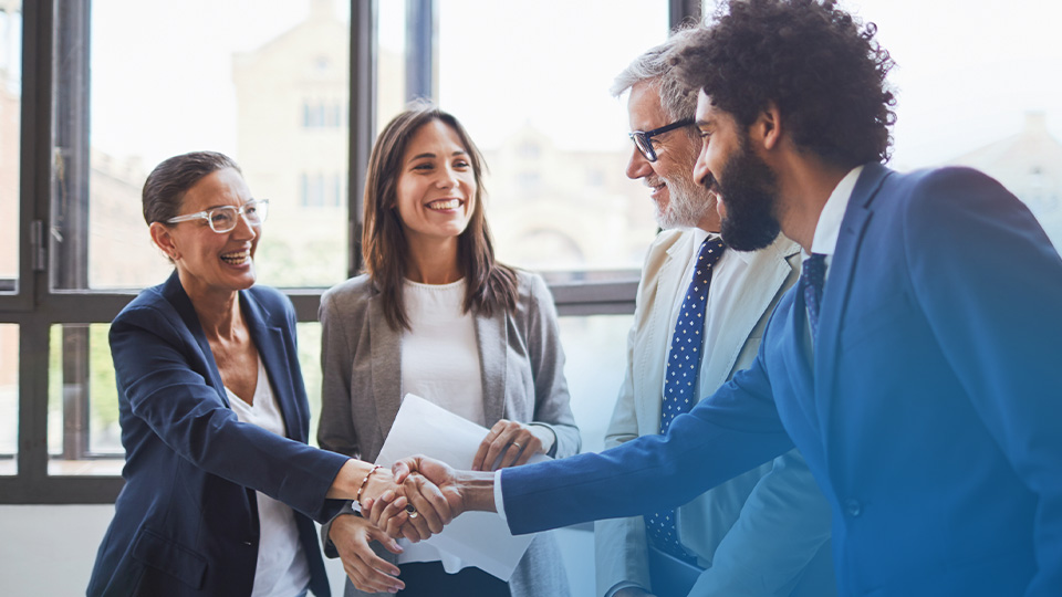 Shaking hands at the end of a business meeting